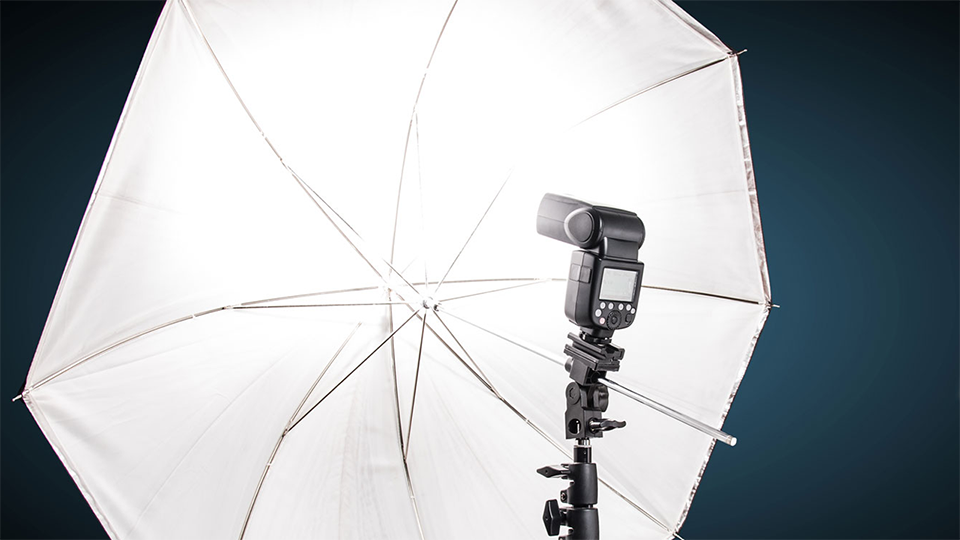 A simple umbrella and flash can work well as a quick setup lighting option for small spaces.