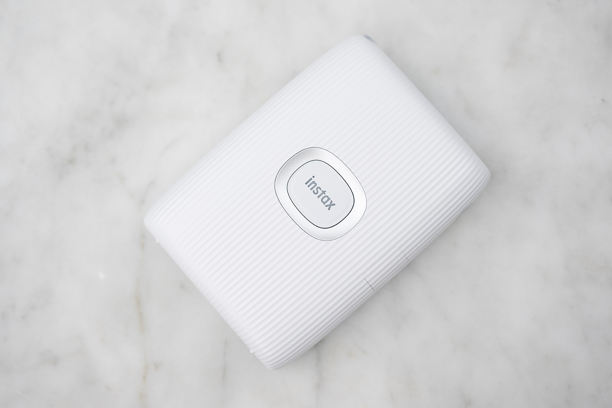 The INSTAX Pal is bundled with a MINI LINK 2 Smartphone Printer. It produces 2.4 x 1.8" prints.