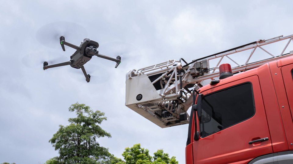 DJI Mavic 3 Thermal Drone hovering by firetruck DJI Mavic 3 Thermal Drone hovering by firetruck