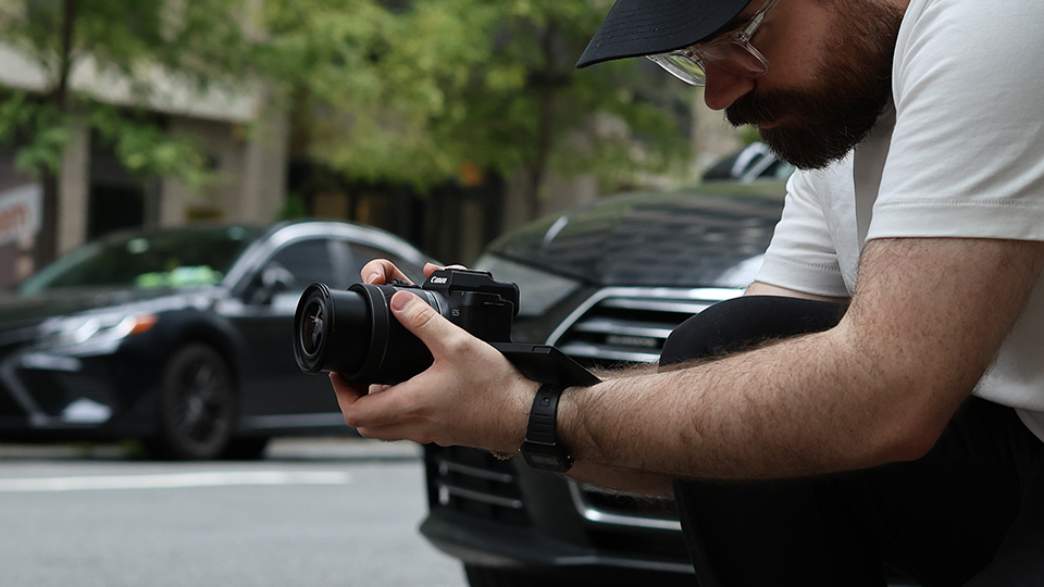 Man shooting with Canon R8 Mark II