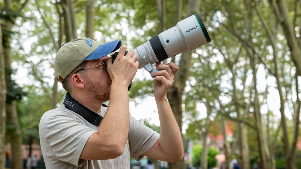 Man shooting with FUJIFILM XF 400mm f/4.5 R LM OIS WR Lens