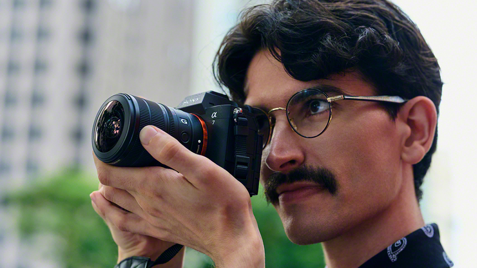 Man with Sony FE 8-14mm f/3.5 G lens