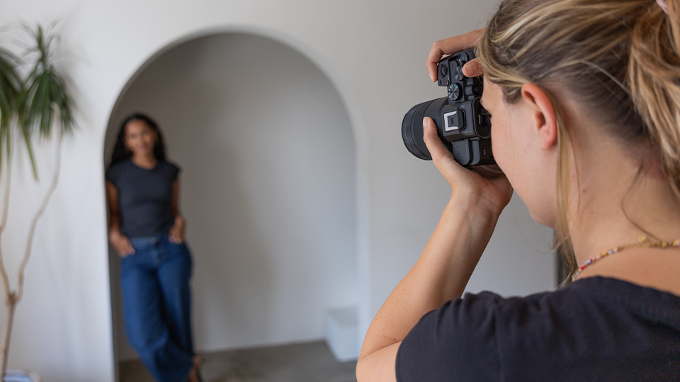 Woman shooting model with Canon R8 Mark II